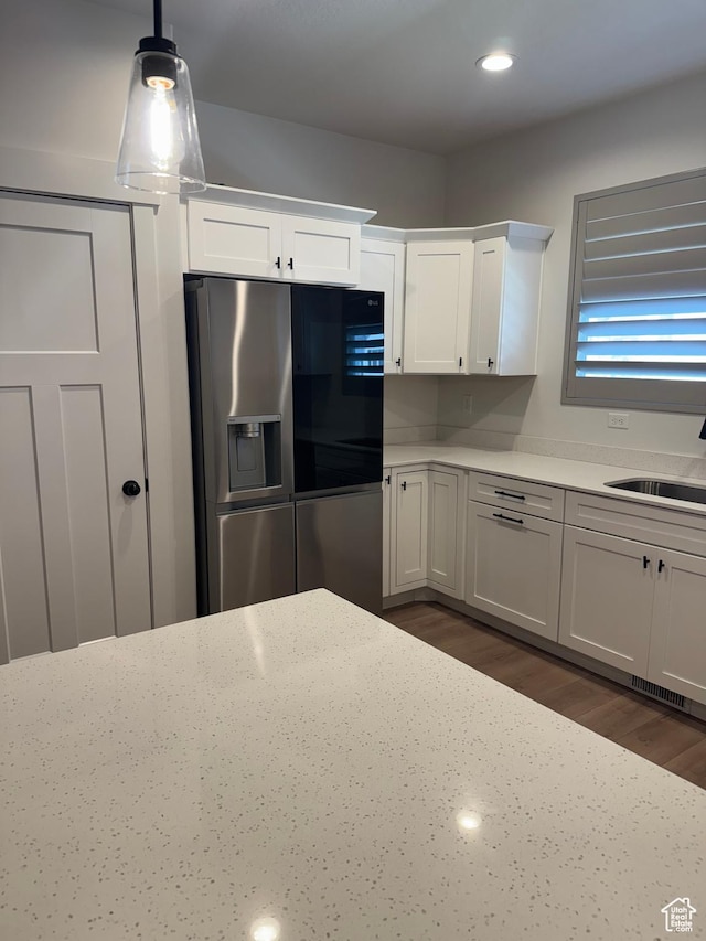 4569 W Ruple Ridge Ln S, Herriman, UT 84096 - kitchen featuring stainless steel fridge with ice dispenser, a sink, white cabinets, dark wood-style flooring, and recessed lighting