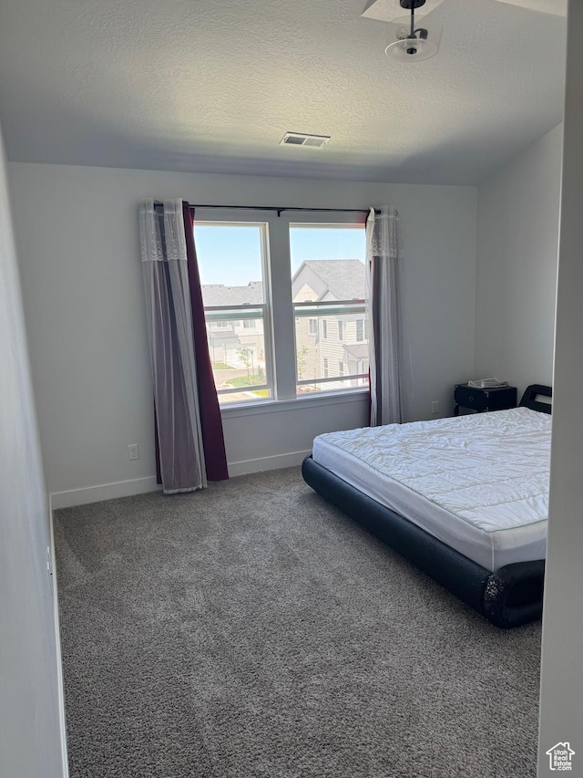 4569 W Ruple Ridge Ln S, Herriman, UT 84096 - carpeted bedroom with baseboards and a textured ceiling