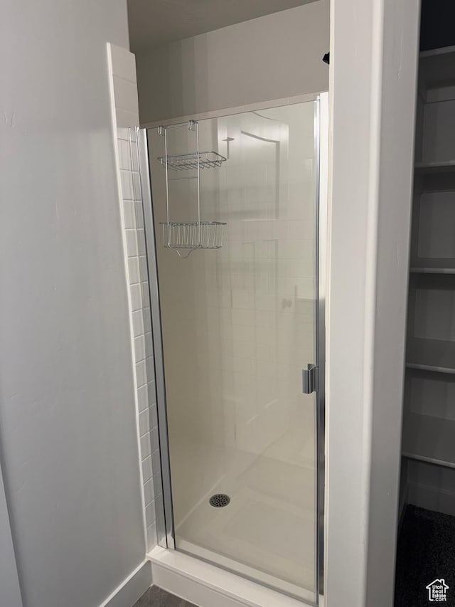 4569 W Ruple Ridge Ln S, Herriman, UT 84096 - full bathroom featuring a shower stall and a walk in closet