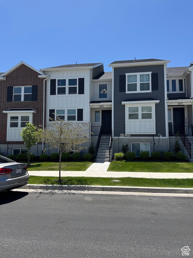 4569 W Ruple Ridge Ln S, Herriman, UT 84096 - view of property with board and batten siding and stairs