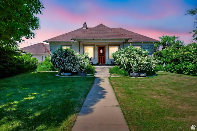 1411 E 13000 N, Cove, UT 84320 - view of front of property featuring a yard, a chimney, and a porch