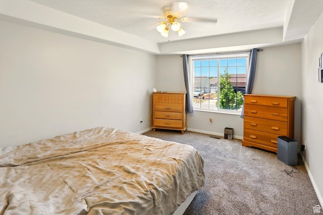2223 S Allison Way, Syracuse, UT 84075 - carpeted bedroom with baseboards, a raised ceiling, and ceiling fan