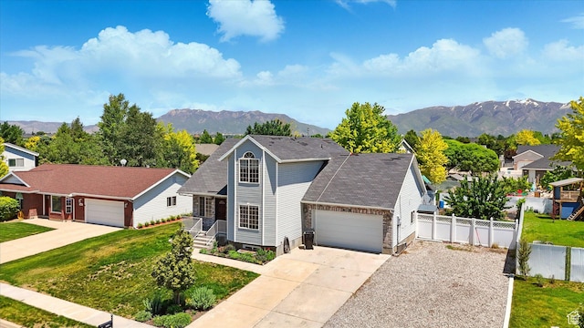 2223 S Allison Way, Syracuse, UT 84075 - traditional-style home with an attached garage, a mountain view, and driveway