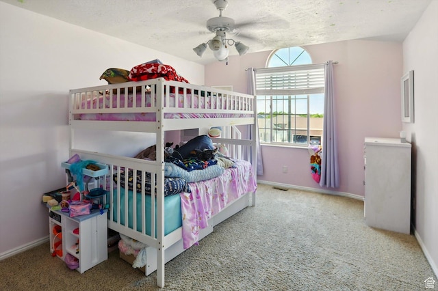 2223 S Allison Way, Syracuse, UT 84075 - carpeted bedroom with baseboards, a textured ceiling, and ceiling fan