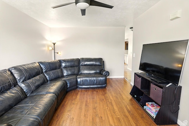 2223 S Allison Way, Syracuse, UT 84075 - living area featuring ceiling fan, wood finished floors, baseboards, and a textured ceiling