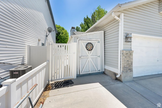 1127 W Monticello Ln, Murray, UT 84123 - doorway to property featuring central AC and a gate