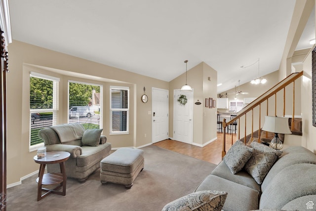 1127 W Monticello Ln, Murray, UT 84123 - living room with vaulted ceiling, carpet flooring, stairway, baseboards, and a chandelier