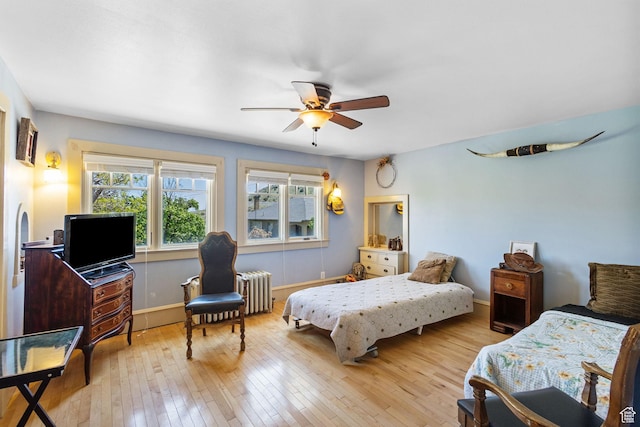 331 Beck St, Eureka, UT 84628 - bedroom with radiator, wood-type flooring, baseboards, and a ceiling fan