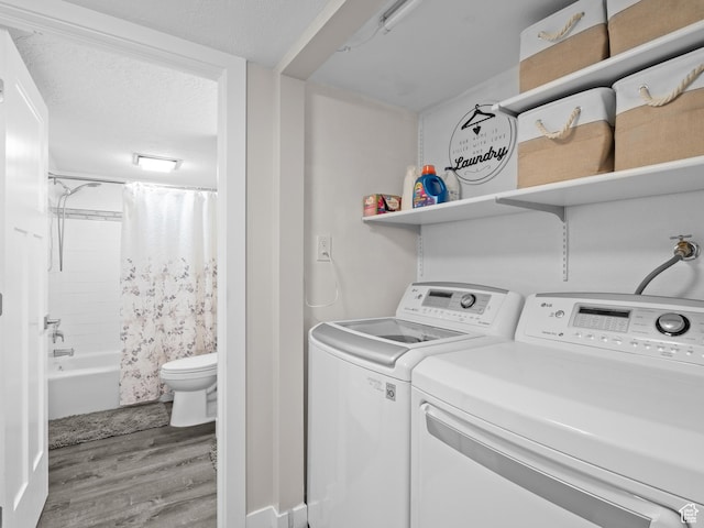 343 Peach Ln, Bountiful, UT 84010 - washroom featuring wood finished floors and washer and clothes dryer