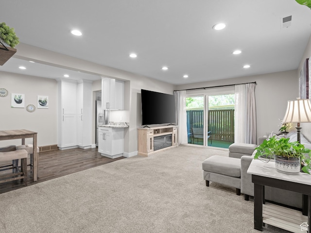 343 Peach Ln, Bountiful, UT 84010 - carpeted living area featuring recessed lighting, baseboards, wood finished floors, and a glass covered fireplace
