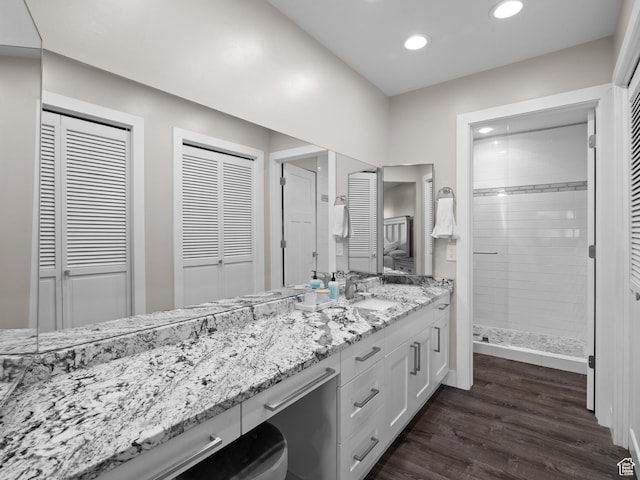 343 Peach Ln, Bountiful, UT 84010 - full bath with a closet, double vanity, recessed lighting, wood finished floors, and a shower stall