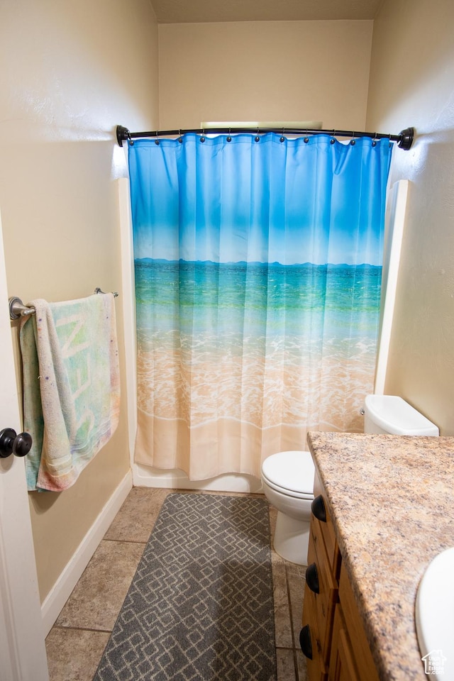 286 E 850 N, Richfield, UT 84701 - bathroom with vanity, toilet, tile patterned floors, baseboards, and shower / tub combo with curtain