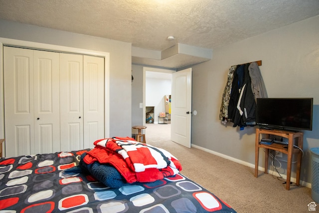 286 E 850 N, Richfield, UT 84701 - carpeted bedroom with a textured ceiling, a closet, and baseboards