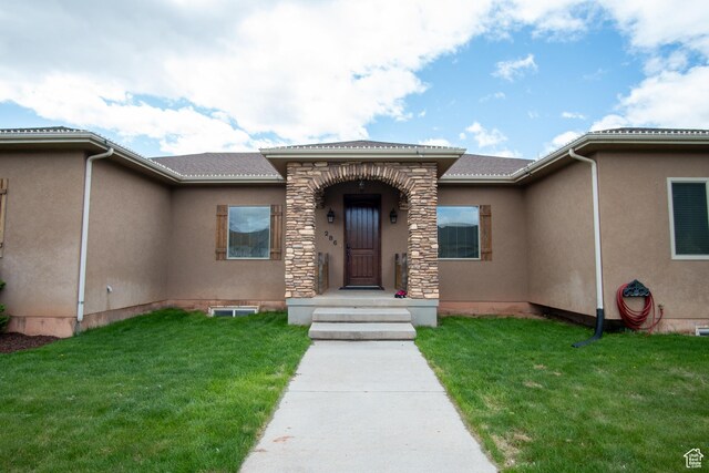 286 E 850 N, Richfield, UT 84701 - doorway to property featuring a lawn and stucco siding