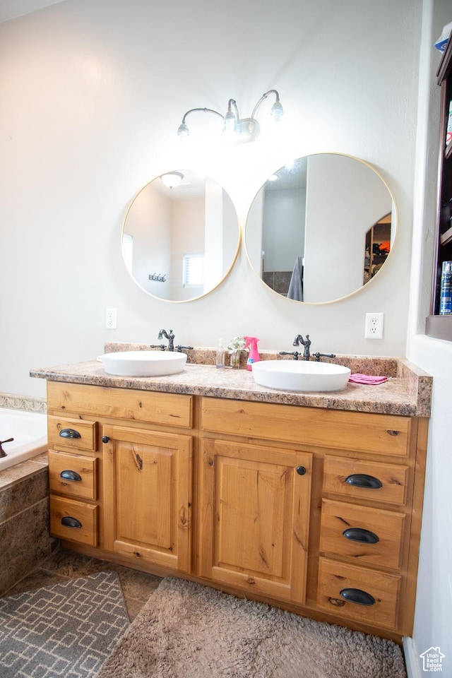 286 E 850 N, Richfield, UT 84701 - full bath featuring double vanity, tiled tub, and tile patterned floors