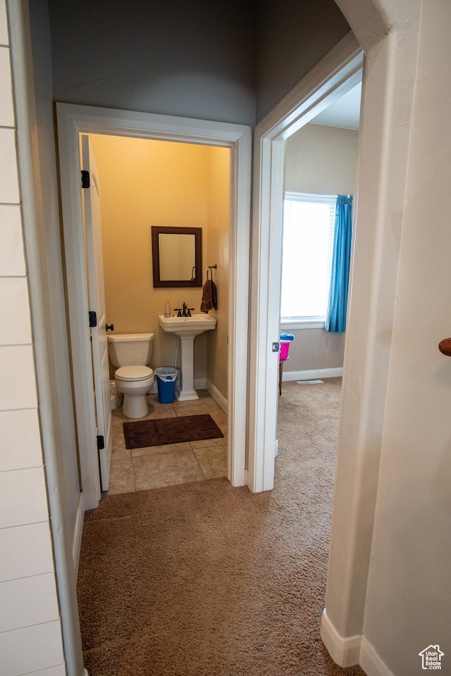 286 E 850 N, Richfield, UT 84701 - bathroom featuring baseboards, toilet, a sink, and tile patterned flooring