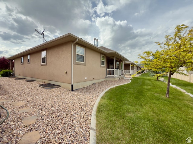 3322 N 750 E, Lehi, UT 84043 - rear view of property with a porch, a lawn, and stucco siding