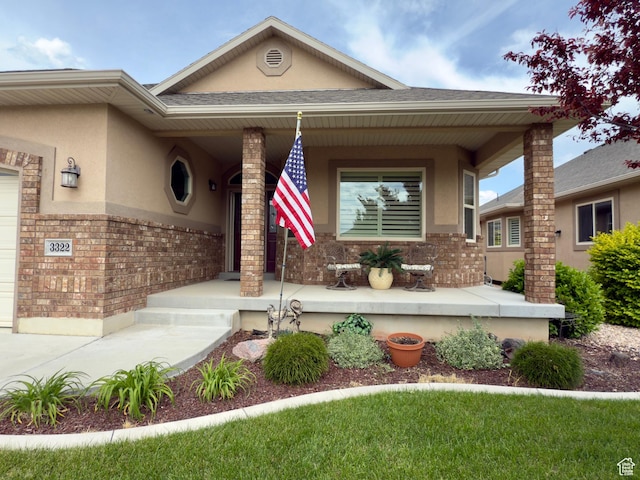 3322 N 750 E, Lehi, UT 84043 - view of front of property featuring a porch, stucco siding, and brick siding