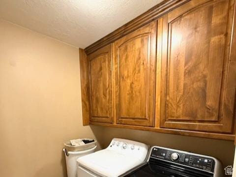 1093 S 1960 E, Spanish Fork, UT 84660 - laundry area with cabinet space, washing machine and dryer, and a textured ceiling