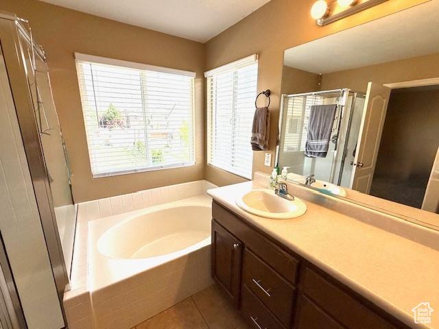 1093 S 1960 E, Spanish Fork, UT 84660 - full bathroom featuring a garden tub, vanity, a stall shower, and tile patterned floors