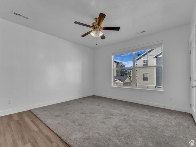 14569 S Bloom Dr W Unit L204, Herriman, UT 84096 - empty room with baseboards, a ceiling fan, and wood finished floors