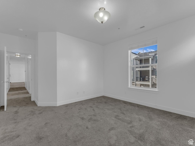 14569 S Bloom Dr W Unit L204, Herriman, UT 84096 - spare room featuring carpet flooring and baseboards