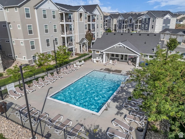 14569 S Bloom Dr W Unit L204, Herriman, UT 84096 - community pool with a patio and a residential view