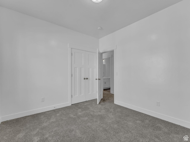 14569 S Bloom Dr W Unit L204, Herriman, UT 84096 - unfurnished bedroom with carpet, baseboards, and a closet