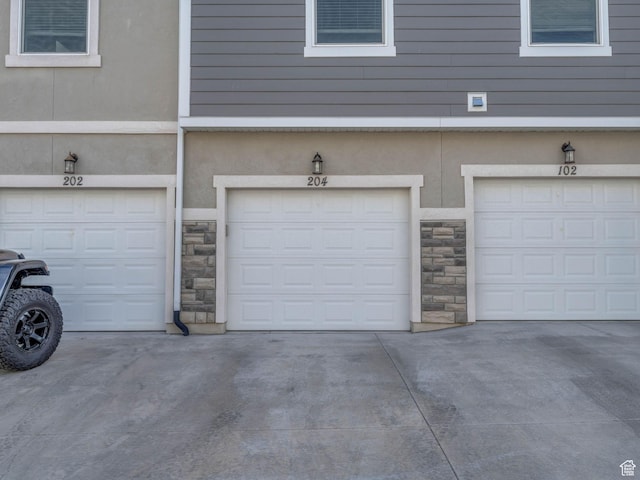 14569 S Bloom Dr W Unit L204, Herriman, UT 84096 - garage with driveway