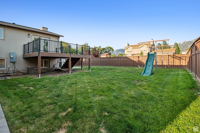 946 E 10715 S, Sandy, UT 84094 - view of yard featuring a wooden deck, stairway, and a playground