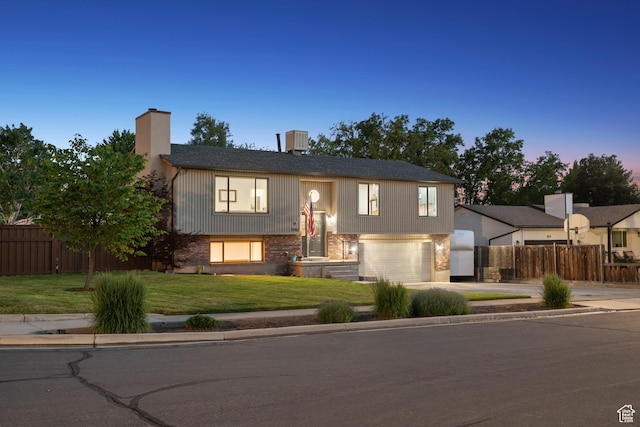 946 E 10715 S, Sandy, UT 84094 - bi-level home with driveway, a chimney, an attached garage, and cooling unit