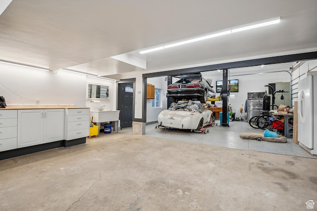 946 E 10715 S, Sandy, UT 84094 - garage with freestanding refrigerator and a sink