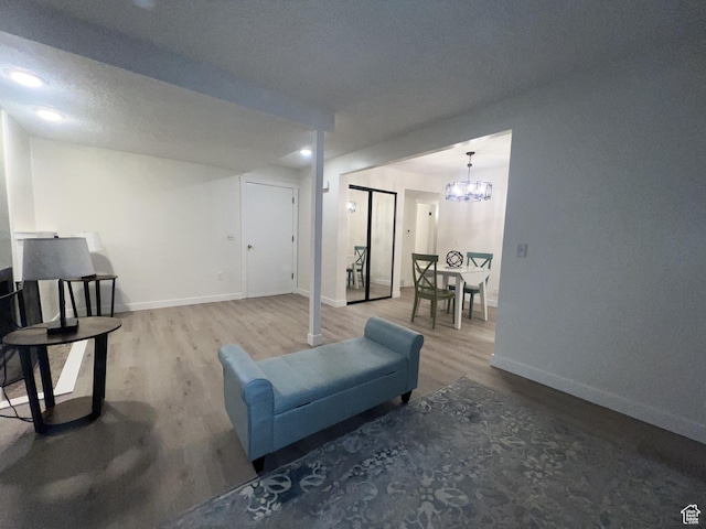 17 E 400 N Unit 27C, Bountiful, UT 84010 - living room featuring wood finished floors and a chandelier