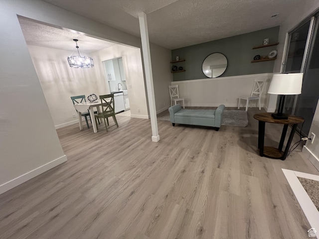 17 E 400 N Unit 27C, Bountiful, UT 84010 - living area with wood finished floors, a textured ceiling, and a chandelier