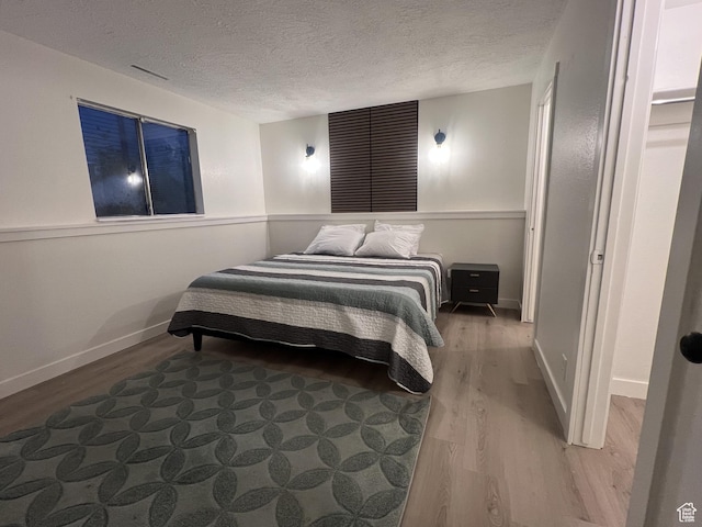 17 E 400 N Unit 27C, Bountiful, UT 84010 - bedroom with wood finished floors and a textured ceiling