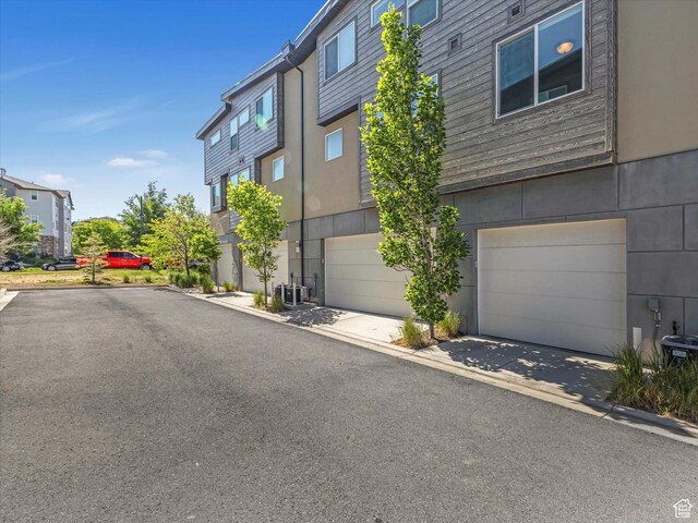 7701 S Navarro View Ct, Midvale, UT 84047 - view of front facade with an attached garage and driveway