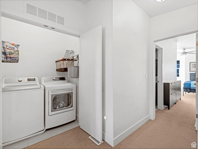 7701 S Navarro View Ct, Midvale, UT 84047 - washroom with washer and clothes dryer, ceiling fan, light carpet, and baseboards