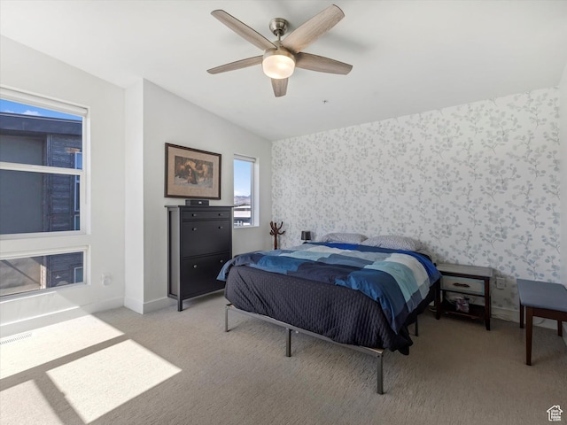 7701 S Navarro View Ct, Midvale, UT 84047 - bedroom featuring wallpapered walls, light carpet, vaulted ceiling, baseboards, and ceiling fan