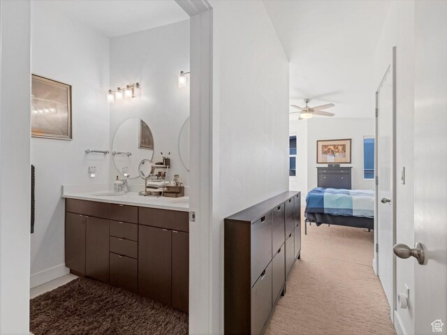 7701 S Navarro View Ct, Midvale, UT 84047 - full bathroom featuring double vanity, ceiling fan, and connected bathroom