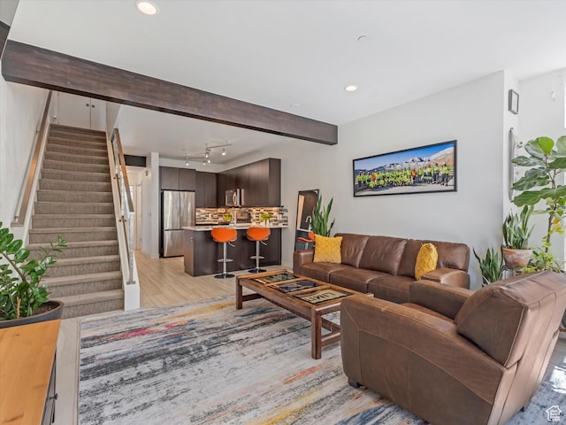 7701 S Navarro View Ct, Midvale, UT 84047 - living area with stairway, light wood-style flooring, recessed lighting, and track lighting