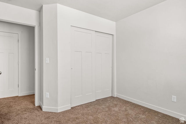 14394 S Oakfield Way, Herriman, UT 84096 - unfurnished bedroom featuring carpet flooring, a closet, and baseboards