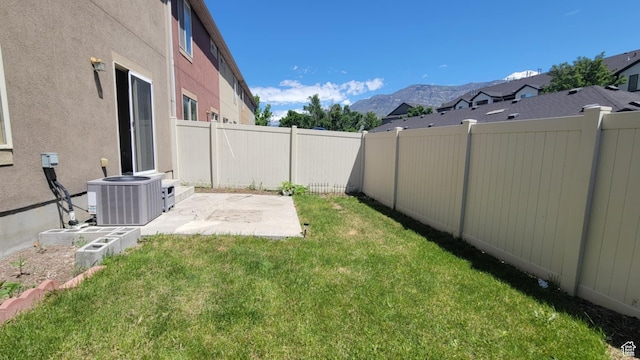 581 S 910 W Unit 86, Pleasant Grove, UT 84062 - view of yard featuring central AC unit, a mountain view, and a patio area