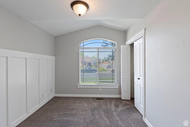 2167 W 2200 S, Syracuse, UT 84075 - unfurnished bedroom with carpet flooring and vaulted ceiling