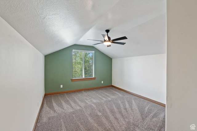 2167 W 2200 S, Syracuse, UT 84075 - additional living space with a ceiling fan, carpet floors, lofted ceiling, baseboards, and a textured ceiling