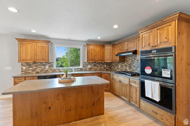 2167 W 2200 S, Syracuse, UT 84075 - kitchen with double oven, light wood-type flooring, tasteful backsplash, a kitchen island, and recessed lighting