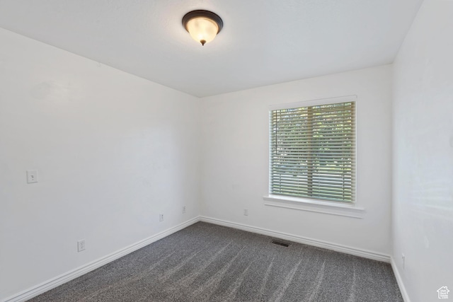 2167 W 2200 S, Syracuse, UT 84075 - unfurnished room featuring dark colored carpet and baseboards