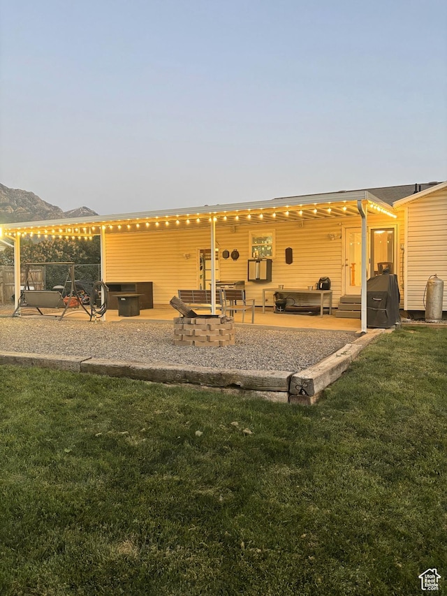 264 W 550 N, Santaquin, UT 84655 - rear view of house with a patio area, a lawn, and a mountain view