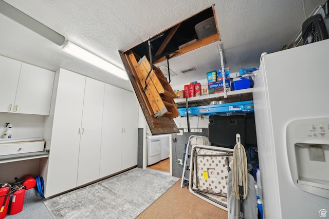 2082 W Jordan Villa Dr, West Jordan, UT 84088 - garage with white fridge with ice dispenser and washer / dryer
