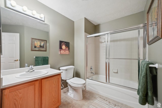 2082 W Jordan Villa Dr, West Jordan, UT 84088 - full bath with vanity, toilet, bath / shower combo with glass door, tile patterned floors, and a textured ceiling