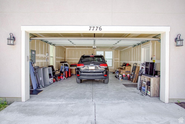 7776 S Iron Core Ln, West Jordan, UT 84081 - garage with electric panel and concrete driveway
